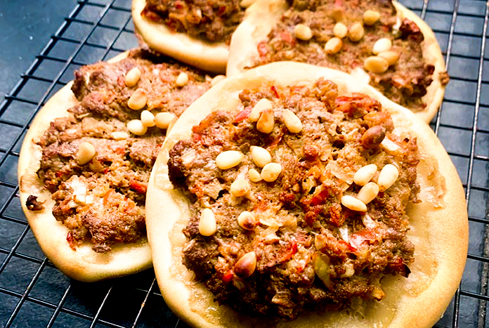 Sfiha, a Palestinian pastry topped with spiced beef.